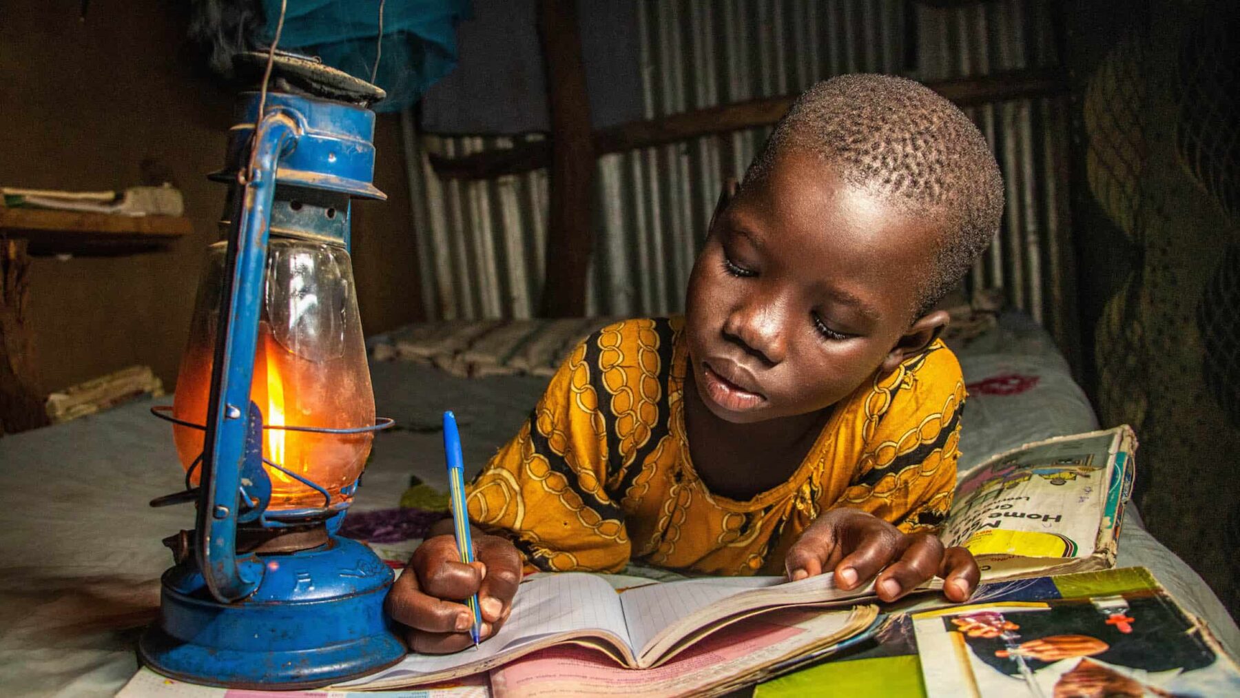 Image for Learning by lamplight, against the odds: photo depicts ‘safety’ for child refugee